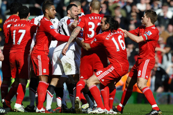 Players from both teams clash after Manchester United's Brazilian defender Rafael Da Silva's foul on Liverpool's Brazilian midfielder Lucas Leiva during the English Premier League football match between Liverpool and Manchester United at Anfield, Liverpool, northwest England, on March 6, 2011.AFP PHOTO/ PAUL ELLIS --- RESTRICTED TO EDITORIAL USE Additional licence required for any commercial/promotional use or use on TV or internet (except identical online version of newspaper) of Premier League/Football League photos. Tel DataCo +44 207 2981656. Do not alter/modify photo (Photo credit should read PAUL ELLIS/AFP/Getty Images)