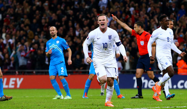 LONDON, ENGLAND - NOVEMBER 15:  Wayne Rooney of England celebrates after scoring his team's first goal from the penalty spot during the EURO 2016 Group E Qualifier match between England and Slovenia at Wembley Stadium on November 15, 2014 in London, England.  (Photo by Jan Kruger - The FA/The FA via Getty Images)