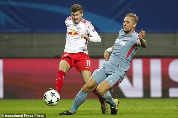 Leipzig's Timo Werner, left, and Monaco's Kamil Glik, right, challenge for the ball during the Champions League Group G first leg soccer match between RB Leipzig and AS Monaco FC in Leipzig, Germany, Wednesday, Sept. 13, 2017. (AP Photo/Michael Sohn)